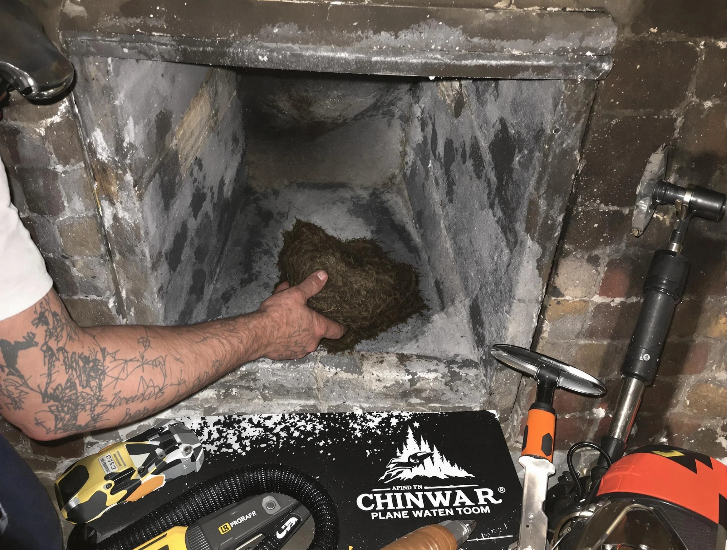 Bountiful Chimney Sweep safely removing debris and screening chimney in Bountiful, UT